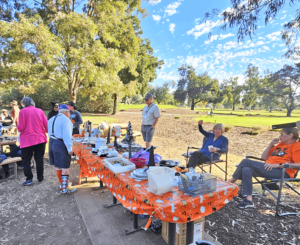 A table of goodies overseen by Scout Master Roger King and Bocce President, Jana King.