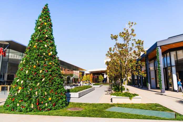 Palo Alto / CA / USA - Christmas tree and holiday decorations at the entrance to the upscale open air Stanford shopping center