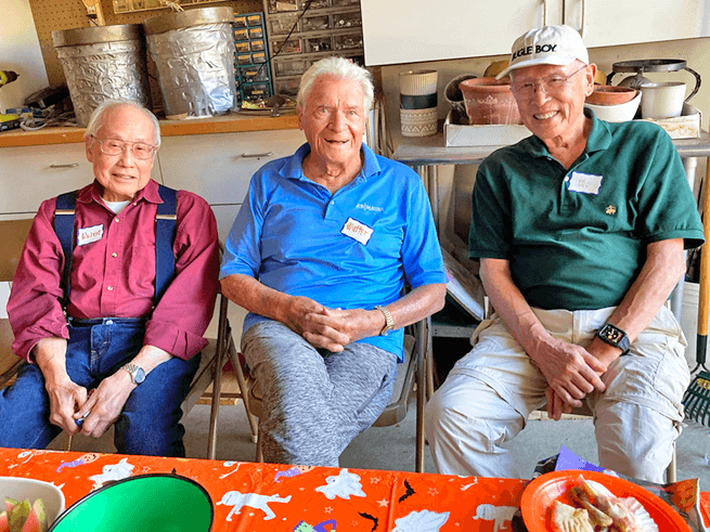 Robert Chin, Walter Howald and Maurice Mow convene for the Pumpkin Roll.