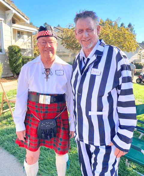 Jim Livingstone and Brian Sullivan dress up in costume for the Olivas Pumpkin roll.