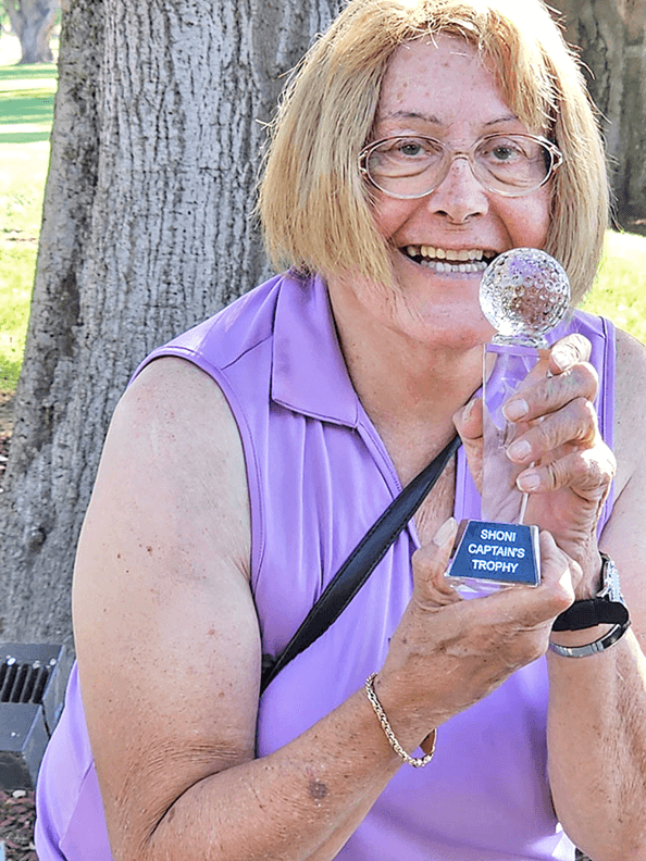 Robin Fish with her Captain’s Trophy for low net.