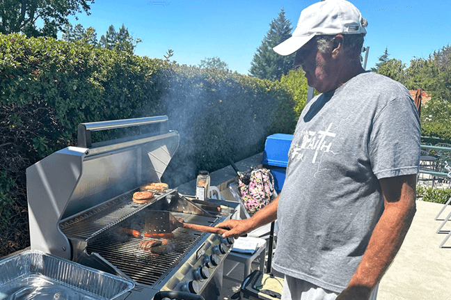 Grill master Brian Dombrowski at the Tennis Club barbecue.