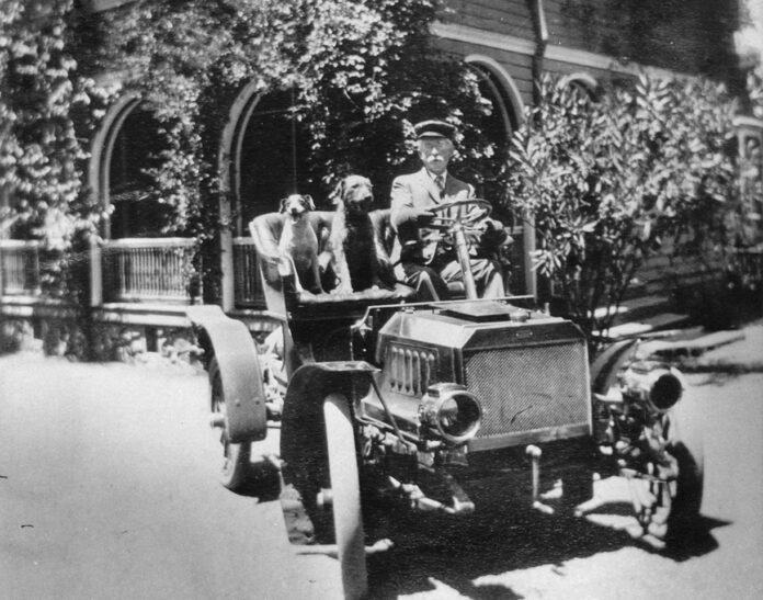 William Wehner in car with two dogs