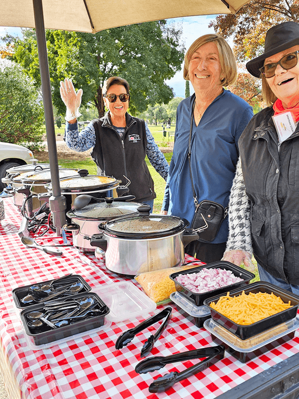 Rose Marie Marcias, Kathleen Pennington and Deborah Strauss dishing up the goodies.