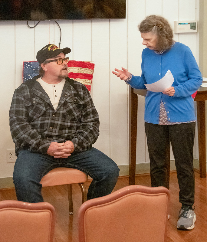 Sandy Juracich presents a quilt to James Halliwell.