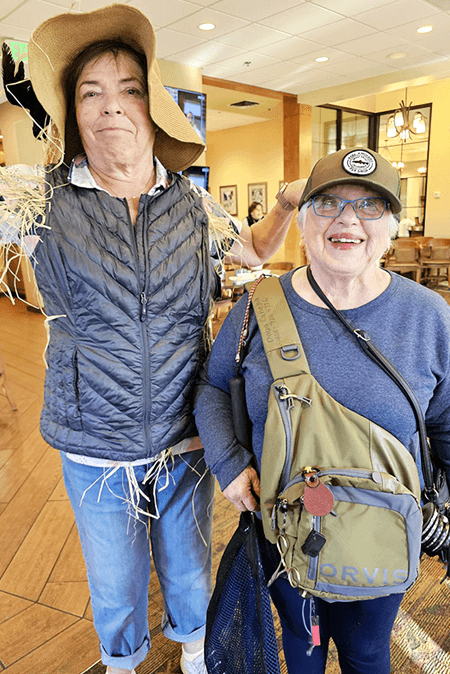 Donna Erickson and Nancy Canepa win first and second place, respectively for their scarecrow and fisherwoman costumes.