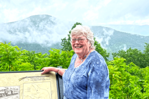 Sara English in front of the Blue Ridge Mountains.