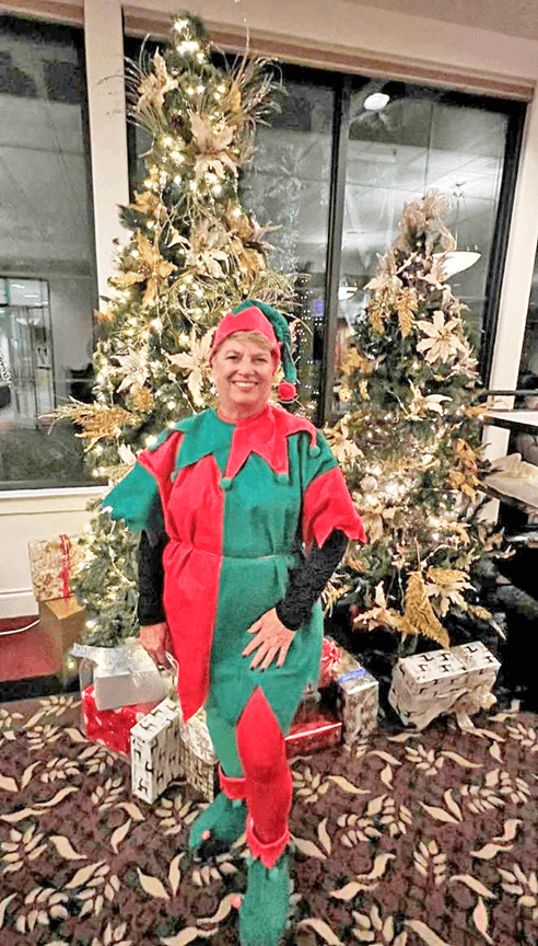 Glen Arden resident and elf, Joanne Fraser, delighting guests as roaming photographer.