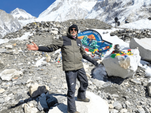 Dinesh Chandra beside the Marker of First Base Station of Mount Everest.