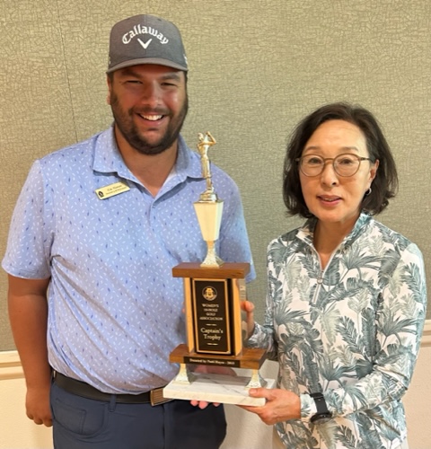 June Captain’s Trophy winner Jane Hong with Golf Pro Eric Hansen